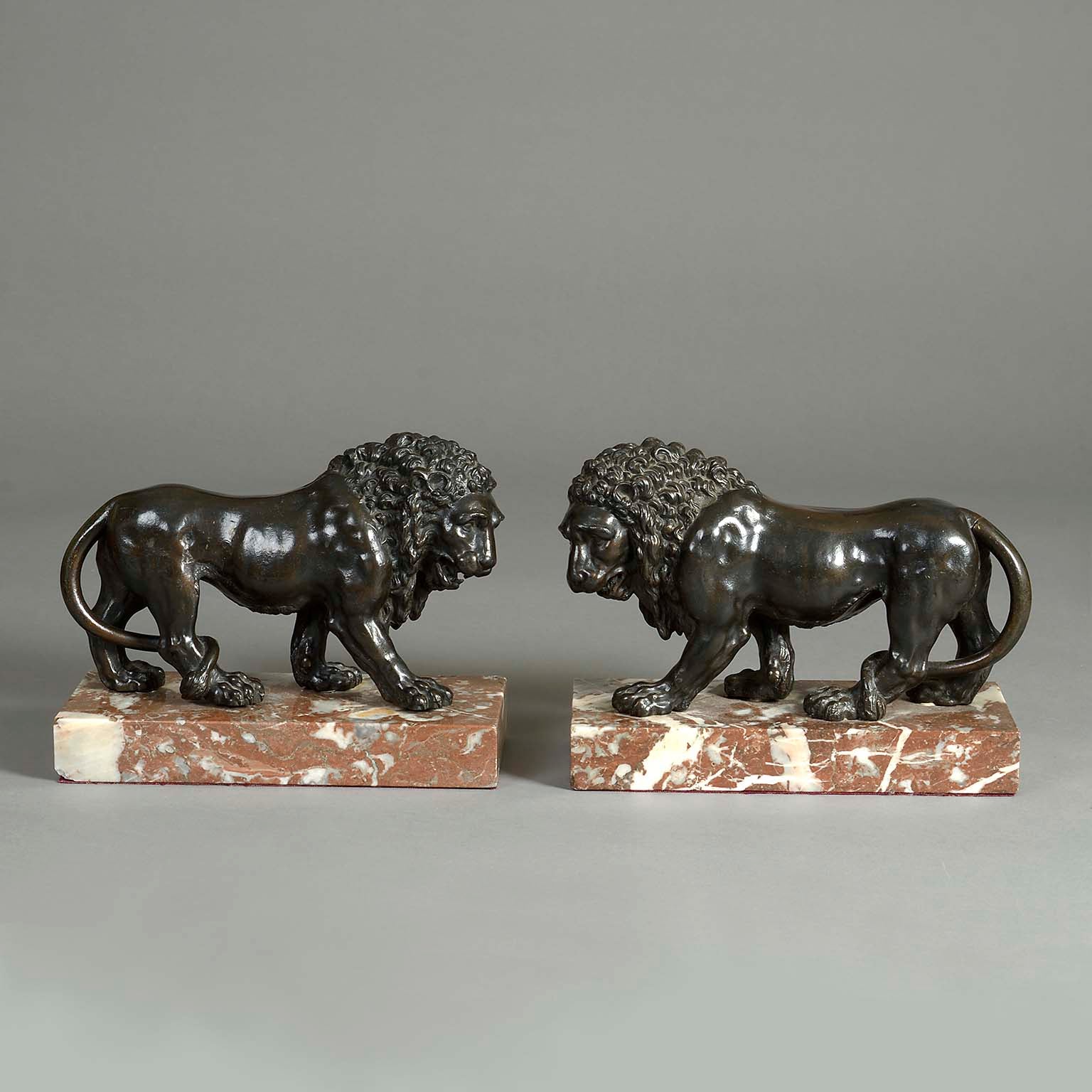 Pair of Bronze Models of Pacing Lions After Canova