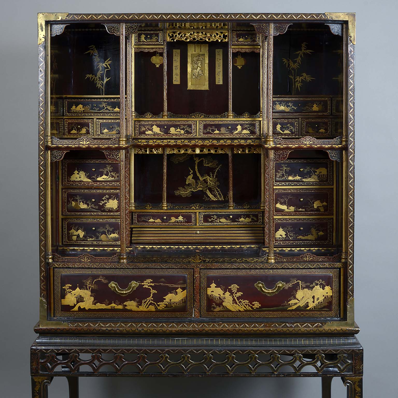 Chinese Export Gilt Decorated Black and Red Lacquer Cabinet on Stand