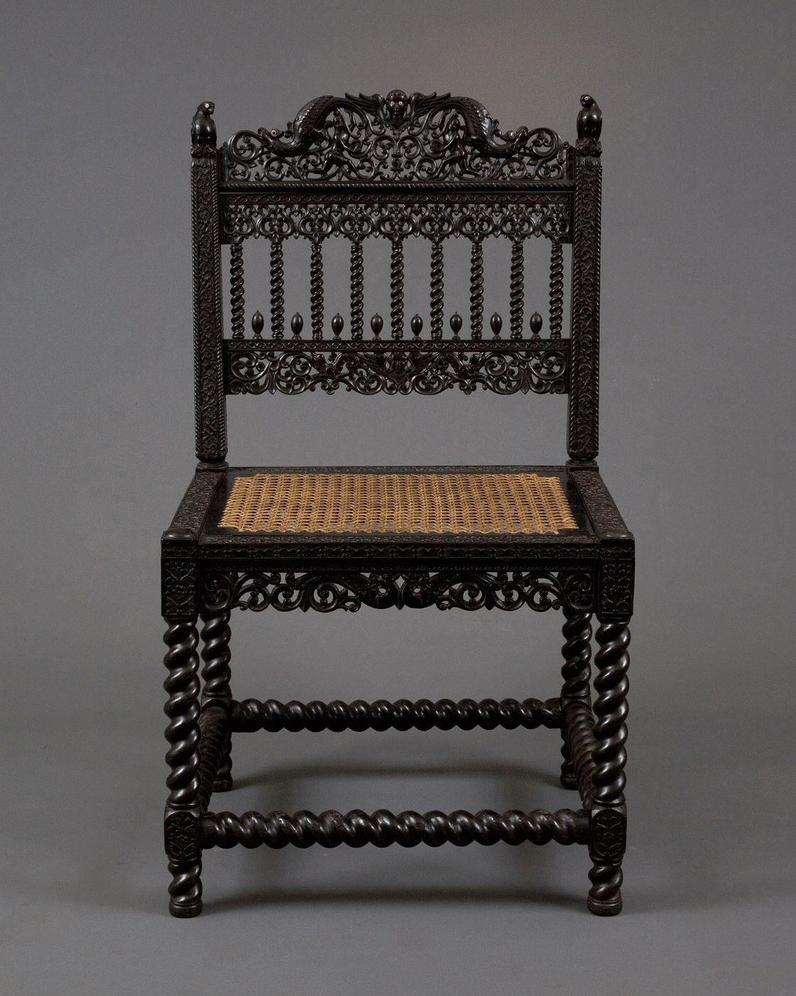 1.  A Pair Of Museum Quality Carved Ebony Chairs