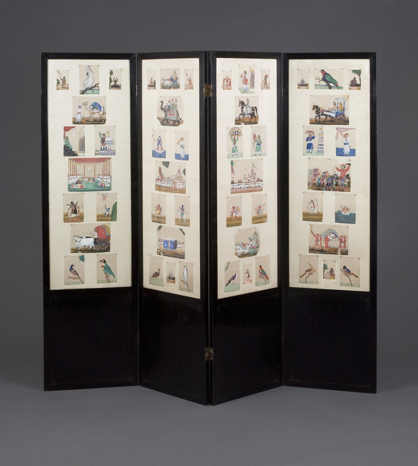 39.  A Four Fold Screen Framing A Collection Of Mica Miniatures