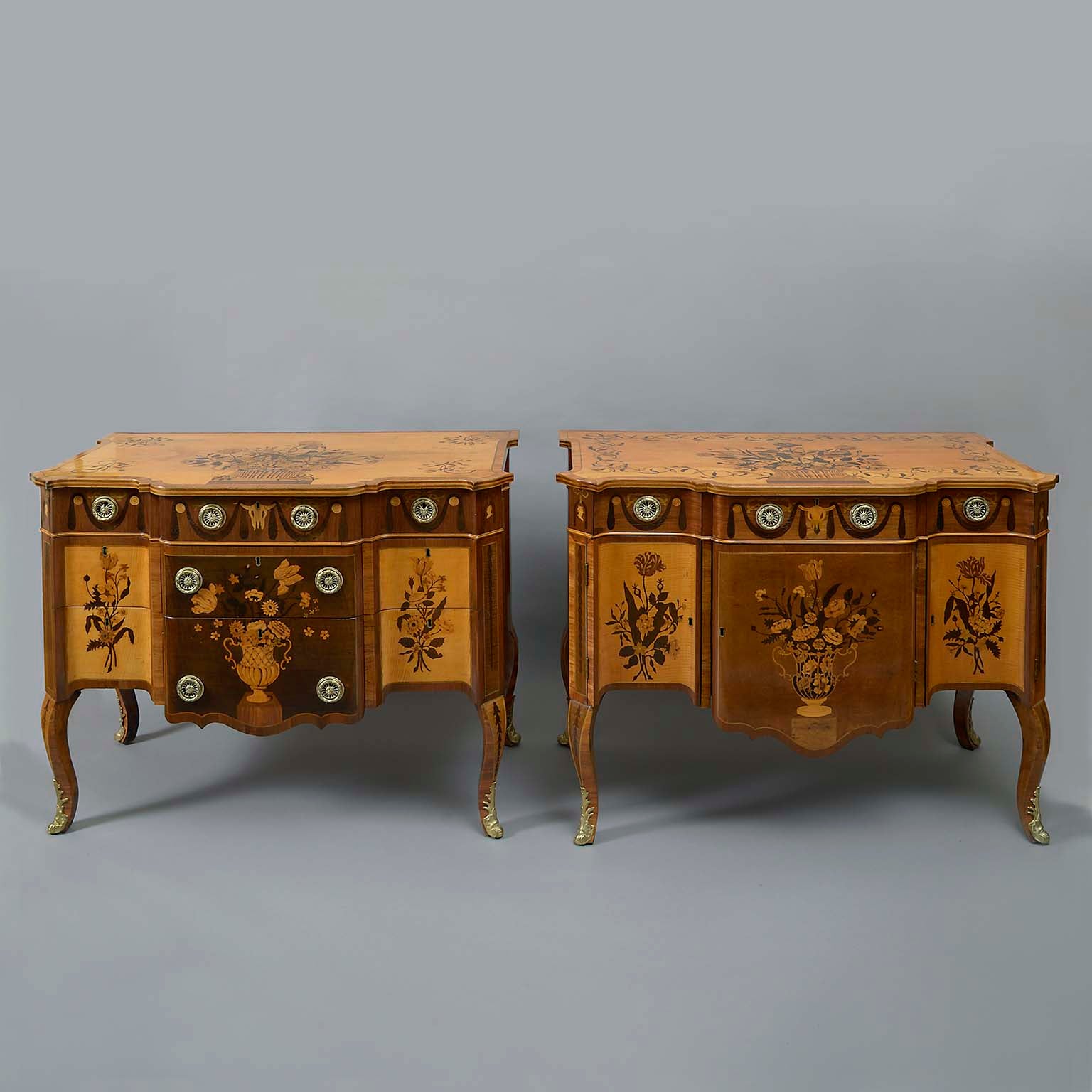 AN IMPORTANT MATCHED PAIR OF IRISH GEORGE III SYCAMORE, AMARANTH AND MARQUETRY COMMODES
