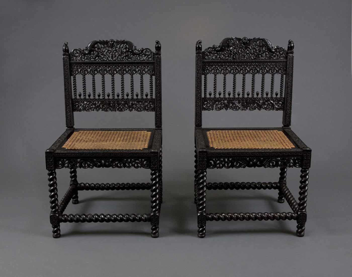 1.  A Pair Of Museum Quality Carved Ebony Chairs